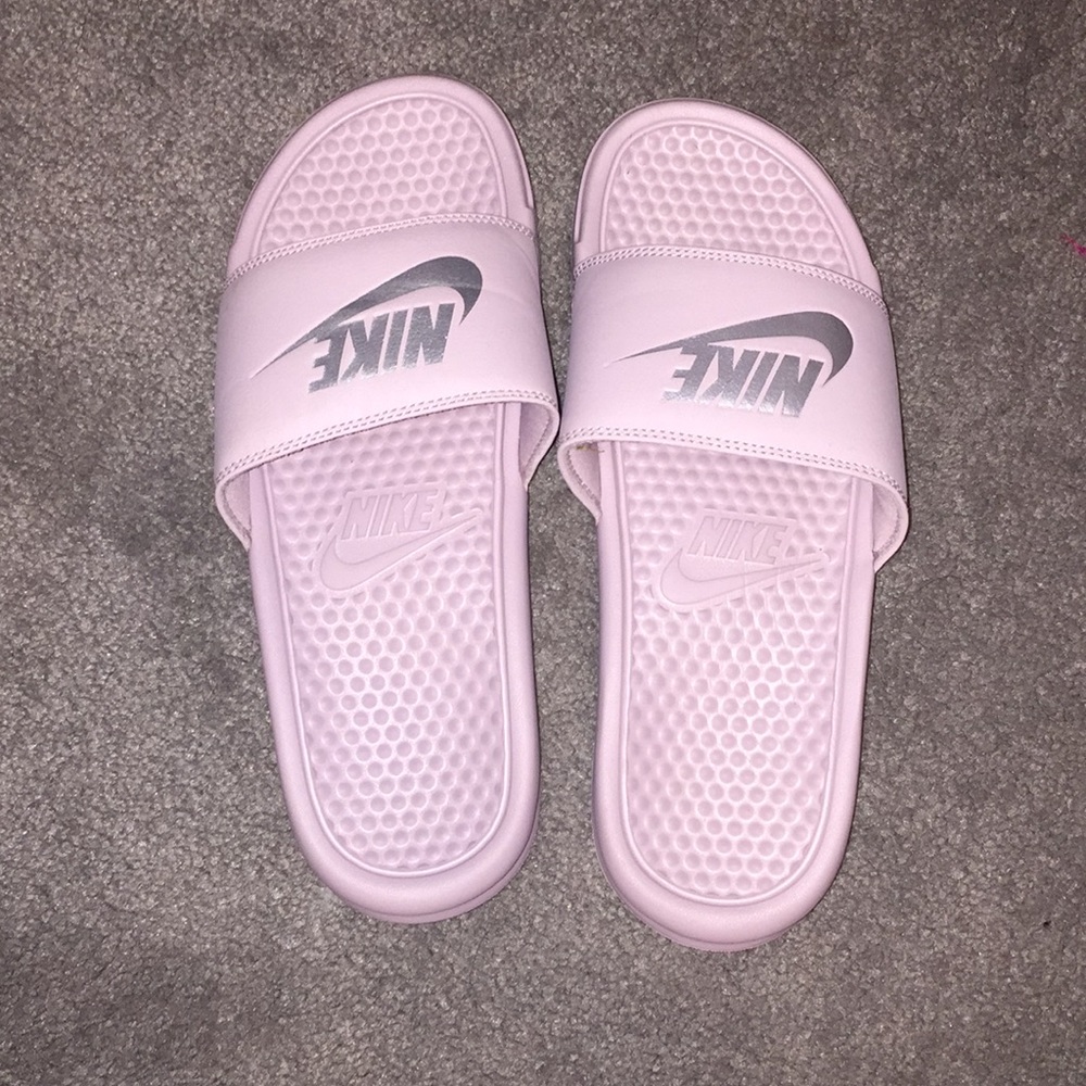 Light pink and silver Nike slides